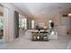 Bright living room featuring plush carpet, large windows with backyard views, and neutral paint at 1020 New Winsor Loop # 46, Sun City Center, FL 33573