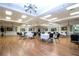 Elegant meeting room with hardwood floors, round tables, and tasteful decor at 1020 New Winsor Loop # 46, Sun City Center, FL 33573