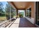 Covered screened porch with tile flooring and outdoor view at 1020 New Winsor Loop # 46, Sun City Center, FL 33573