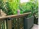 View of the balcony railing with potted plants adding a touch of nature at 1032 S Pointe Alexis Dr, Tarpon Springs, FL 34689