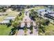 A community entrance, featuring manicured landscaping, a pond with fountain, and many other green spaces at 1034 Mcdaniel St # 1034, Sun City Center, FL 33573