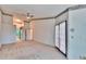 Large bedroom with neutral carpet, ceiling fan, and decorated trim along the ceiling at 1034 Mcdaniel St # 1034, Sun City Center, FL 33573