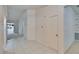The foyer is open to the living room with ceramic tile flooring and access to closet at 1034 Mcdaniel St # 1034, Sun City Center, FL 33573