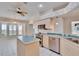 Bright kitchen featuring an island, stainless appliances, and dining area with bay window at 1034 Mcdaniel St # 1034, Sun City Center, FL 33573