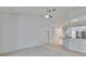 Bright open living room features white walls and carpet flooring at 1034 Mcdaniel St # 1034, Sun City Center, FL 33573