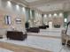 Lobby area with white marble tile, neutral furnishings, art work, and high ceilings at 1034 Mcdaniel St # 1034, Sun City Center, FL 33573