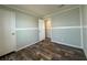 Bedroom featuring a closet, white doors and trim, and modern flooring at 105 W Saint Johns Way, Apollo Beach, FL 33572