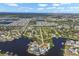 Expansive aerial shot showcasing waterfront properties on canals, a coastal community and easy access to the open bay at 107 6Th Nw St, Ruskin, FL 33570