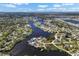 Stunning aerial view of waterfront homes along a scenic canal with easy access to the open bay and a vibrant coastal community at 107 6Th Nw St, Ruskin, FL 33570