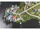 Aerial view of houses in a neighborhood with waterfront views, docks, and community amenities at 107 6Th Nw St, Ruskin, FL 33570