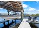 Boat lift with boat providing convenient water access and adding value to waterfront property at 107 6Th Nw St, Ruskin, FL 33570