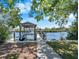 Dock with boat lift providing convenient access to the water and showcasing waterfront living at 107 6Th Nw St, Ruskin, FL 33570