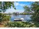 View of the private dock, offering direct access to the water and scenic neighborhood views at 107 6Th Nw St, Ruskin, FL 33570