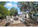 The outdoor fire pit and seating offer a relaxing gathering space by the waterfront at 107 6Th Nw St, Ruskin, FL 33570