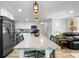 Bright kitchen boasts stainless steel appliances, counter seating, and ample cabinetry at 107 6Th Nw St, Ruskin, FL 33570