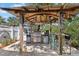 Outdoor kitchen with grill, mini-fridge, and bar seating for cooking, dining, and entertaining friends and Gathering at 107 6Th Nw St, Ruskin, FL 33570