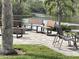 Outdoor amenity featuring a fire pit and seating area near the water, great for relaxing and socializing at 111 Woodland Pl, Osprey, FL 34229