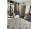 Cozy bedroom with a queen bed, and sliding glass door to a screened patio at 111 Woodland Pl, Osprey, FL 34229