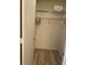 Walk-in closet with ample hanging space and built-in shelving at 111 Woodland Pl, Osprey, FL 34229
