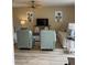 Comfortable living room with two sofas, two accent chairs, and a ceiling fan at 111 Woodland Pl, Osprey, FL 34229