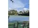 Well-maintained community tennis court surrounded by lush landscaping and mature trees at 111 Woodland Pl, Osprey, FL 34229