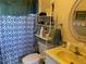 Compact bathroom with a shower curtain, vanity sink, and essential toiletries at 11450 Harbor Way # 5002, Largo, FL 33774
