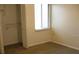Bright bedroom with closet space and a large window, perfect for a restful retreat at 11450 Harbor Way # 5002, Largo, FL 33774