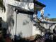 Condo exterior featuring a gray storage area, entrance stairs, and a place to park your bicycles at 11450 Harbor Way # 5002, Largo, FL 33774