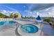 Relax in the outdoor hot tub and enjoy views of the pool, clubhouse, and beautiful surrounding scenery at 11450 Harbor Way # 5002, Largo, FL 33774