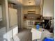 Cozy kitchen with white appliances, plenty of storage, and a vintage range hood at 11450 Harbor Way # 5002, Largo, FL 33774