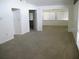 Spacious living room with neutral carpet and bright windows, offering a versatile living space at 11450 Harbor Way # 5002, Largo, FL 33774
