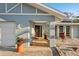 Inviting front porch featuring a tiled entryway, plants and seating, and a bright, welcoming entrance at 1360 Overbrook Rd, Englewood, FL 34223