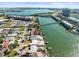 Expansive aerial view showcasing the waterfront home, private dock, and beautiful surrounding neighborhood at 1445 Corey S Way, South Pasadena, FL 33707