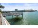 Waterfront property featuring a private dock, offering serene views and direct water access at 1445 Corey S Way, South Pasadena, FL 33707