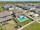 Backyard with a private pool, lounge chairs, and a well-maintained lawn surrounded by a white fence at 14637 Red Castle Ave, Lithia, FL 33547