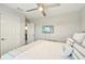 Bright bedroom featuring a ceiling fan and a mounted TV for ultimate relaxation at 14637 Red Castle Ave, Lithia, FL 33547