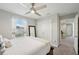 Cozy bedroom with ample closet space, a ceiling fan, and a window view of the exterior at 14637 Red Castle Ave, Lithia, FL 33547