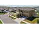 Two-story home featuring neat landscaping, a two car garage, and street view at 14637 Red Castle Ave, Lithia, FL 33547