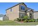 Well-maintained home featuring a landscaped yard and a charming facade in a pleasant neighborhood at 14637 Red Castle Ave, Lithia, FL 33547