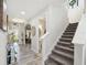 Inviting entryway and stairway showcasing wood-look flooring and natural light at 14637 Red Castle Ave, Lithia, FL 33547