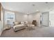 Cozy living room with plush gray carpeting, neutral walls, and a comfortable sectional sofa at 14637 Red Castle Ave, Lithia, FL 33547