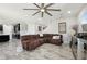 Open-concept living room showcasing wood-look floors and ample space for Gathering gatherings at 14637 Red Castle Ave, Lithia, FL 33547
