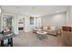 Cozy living room with comfortable seating, neutral decor, and a view into the bedroom, creating a relaxing space at 14637 Red Castle Ave, Lithia, FL 33547