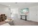 Spacious living area with a TV, console table, and stylish marble coffee table at 14637 Red Castle Ave, Lithia, FL 33547