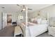 Bright bedroom with four-poster bed, bench, and decor at 14637 Red Castle Ave, Lithia, FL 33547