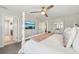Bright bedroom featuring a four-poster bed and television at 14637 Red Castle Ave, Lithia, FL 33547