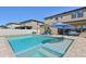 Spacious backyard pool and patio area with an umbrella table and lounge seating at 14637 Red Castle Ave, Lithia, FL 33547