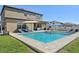 Backyard pool, outdoor patio, and grill, with lawn and seating areas at 14637 Red Castle Ave, Lithia, FL 33547