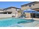 Inviting backyard pool area with a spa, patio seating, and lush landscaping at 14637 Red Castle Ave, Lithia, FL 33547