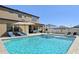 Backyard pool and patio area with multiple seating options and an outdoor grill at 14637 Red Castle Ave, Lithia, FL 33547
